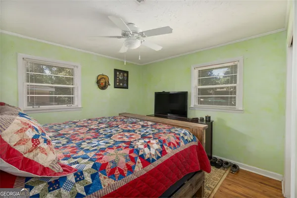 a bedroom with a large bed and a window