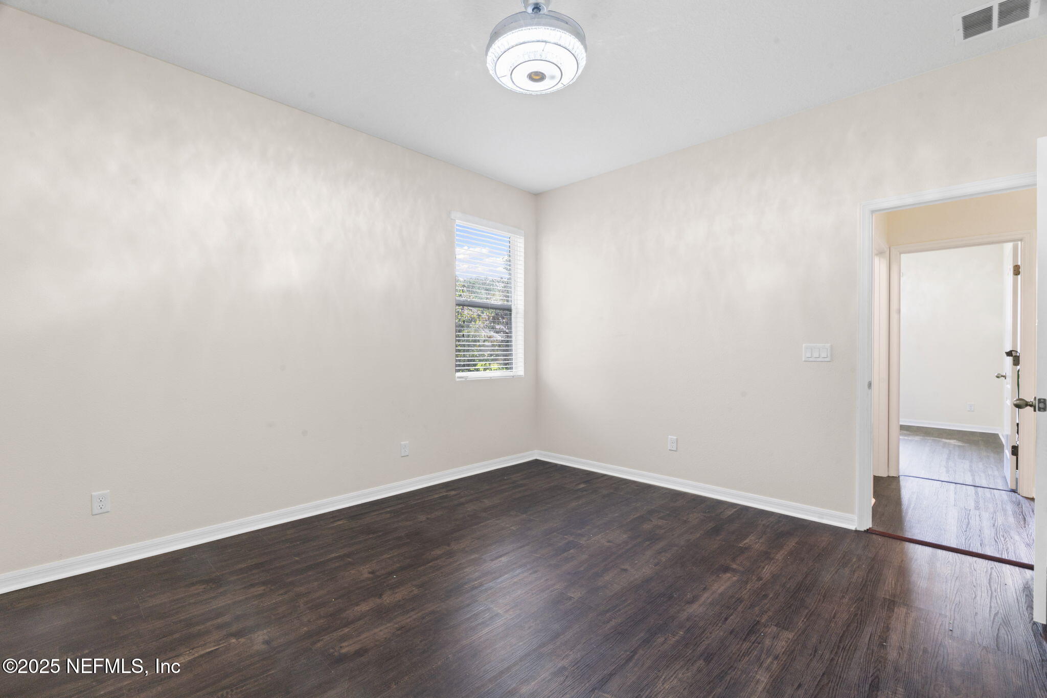 28 Riachuelo Lane St. Augustine, FL 32095 - Photo 13 of 90 an empty room with wooden floor and windows