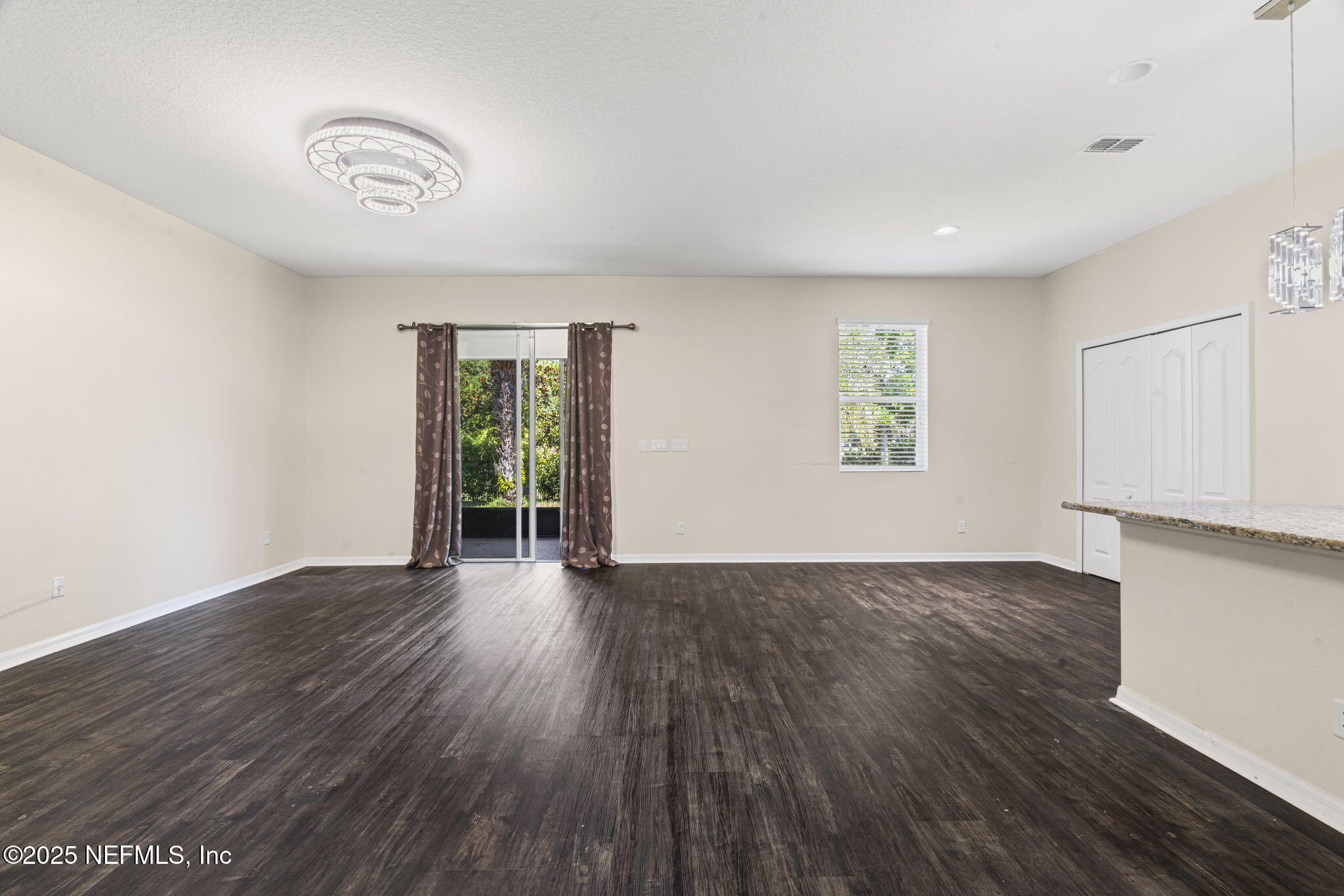 28 Riachuelo Lane St. Augustine, FL 32095 - Photo 17 of 90 a view of an empty room with wooden floor and a window