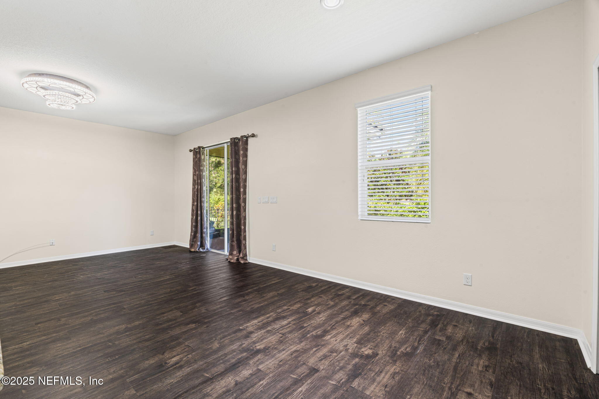 28 Riachuelo Lane St. Augustine, FL 32095 - Photo 22 of 90 an empty room with wooden floor and windows