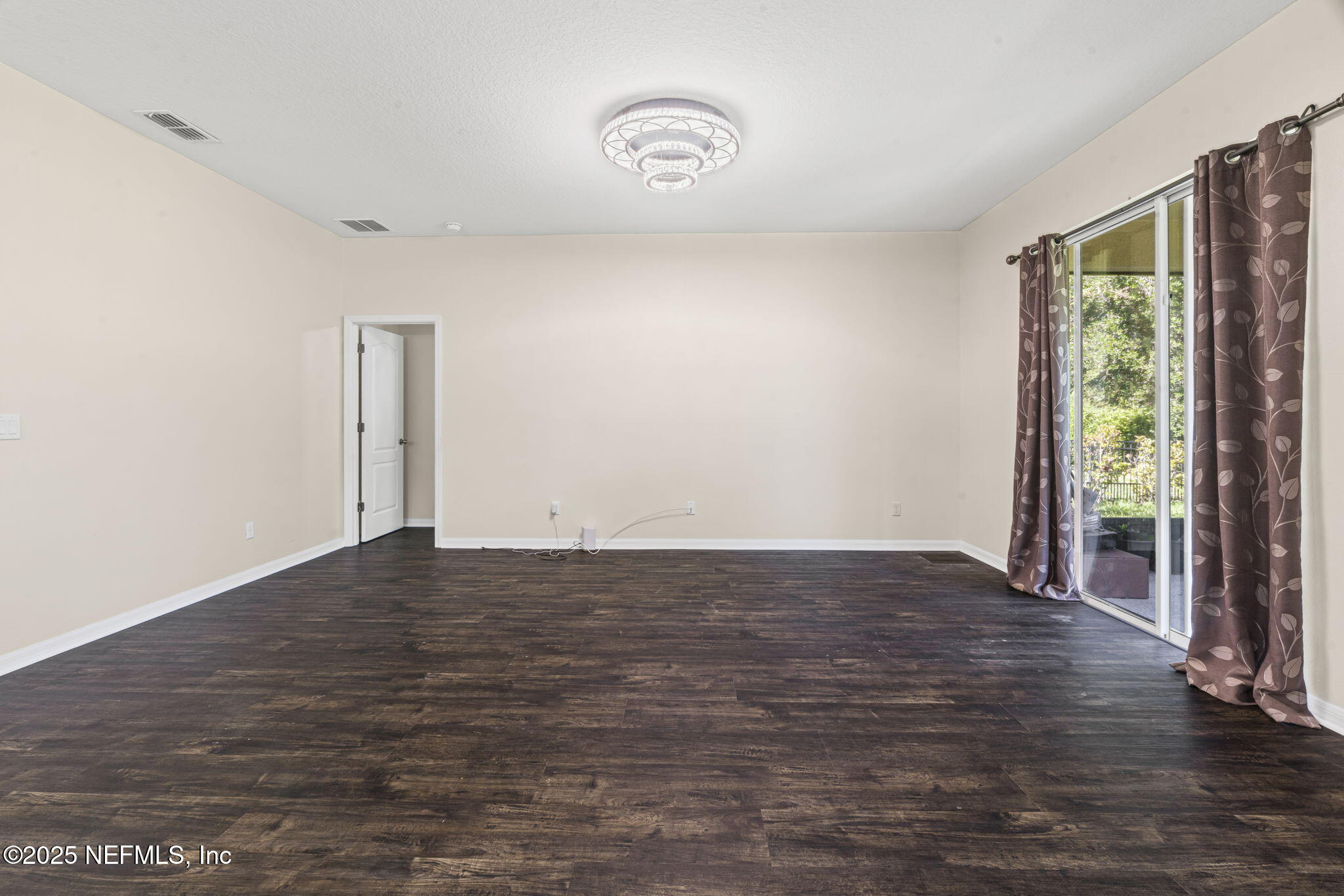 28 Riachuelo Lane St. Augustine, FL 32095 - Photo 25 of 90 a view of an empty room with wooden floor and a window