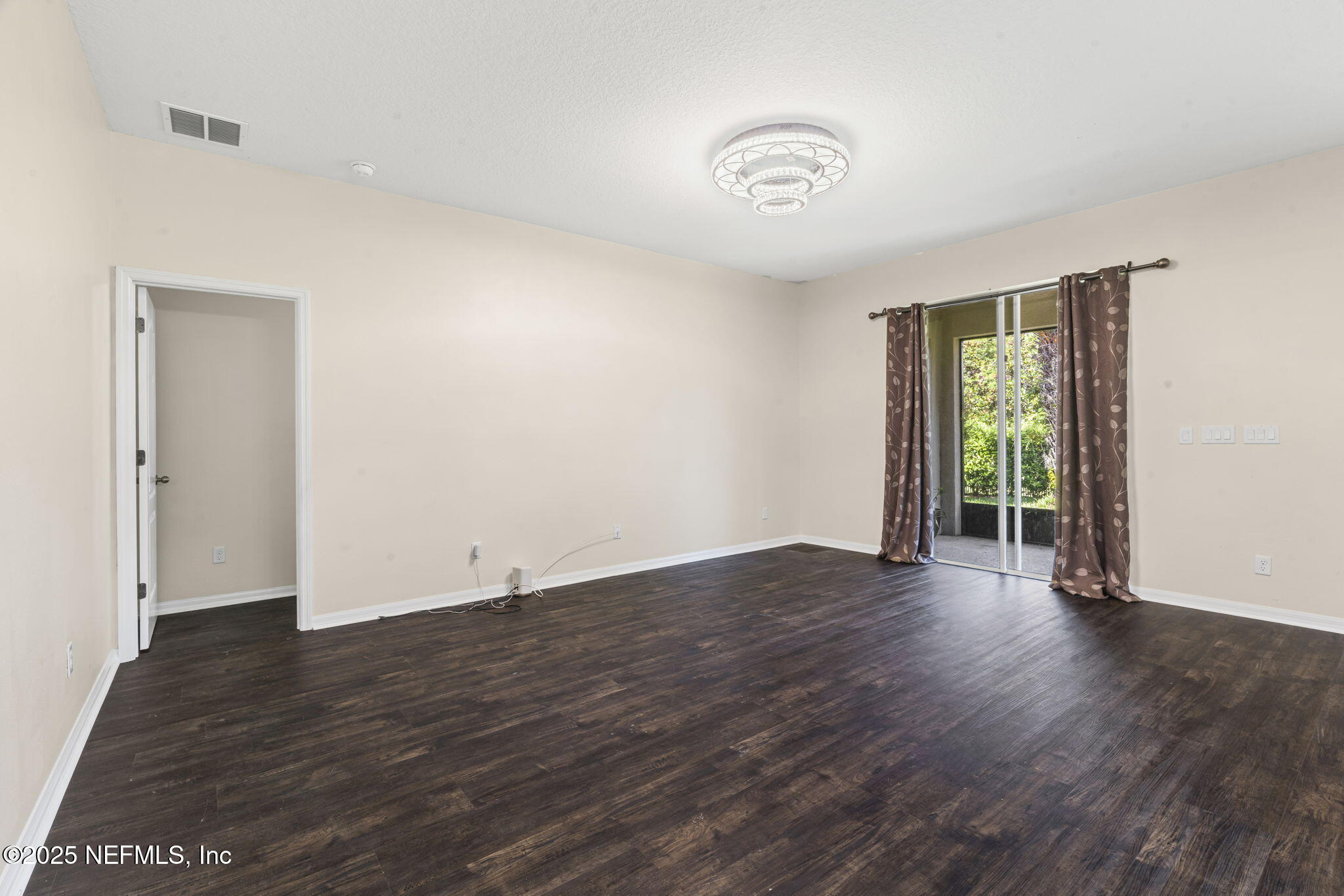 28 Riachuelo Lane St. Augustine, FL 32095 - Photo 27 of 90 an empty room with wooden floor and windows