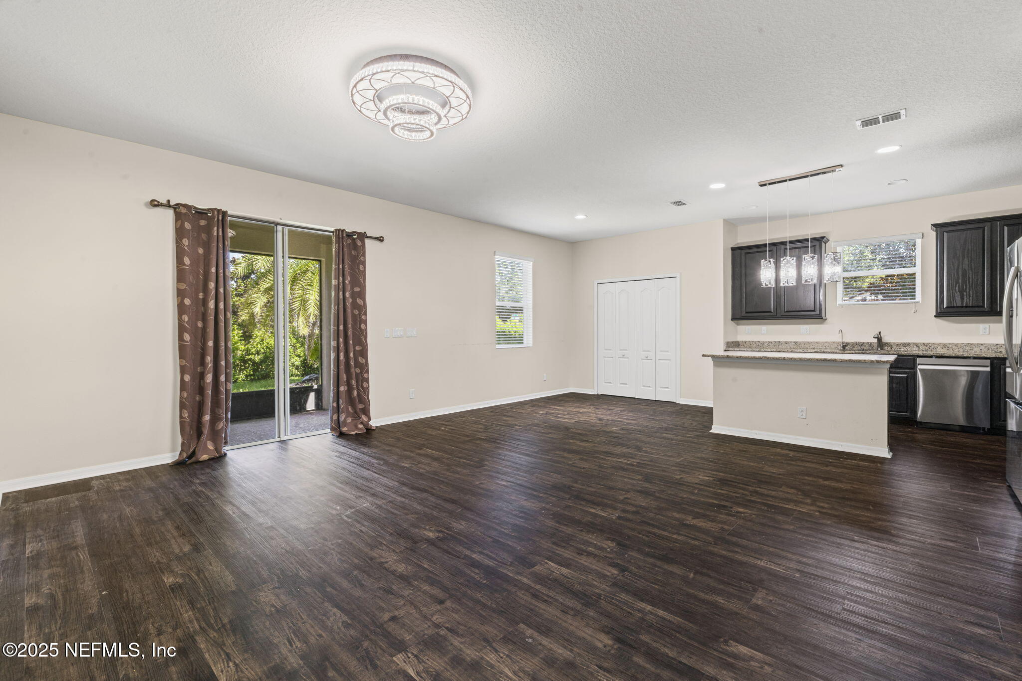 28 Riachuelo Lane St. Augustine, FL 32095 - Photo 29 of 90 a view of an empty room with window and wooden floor