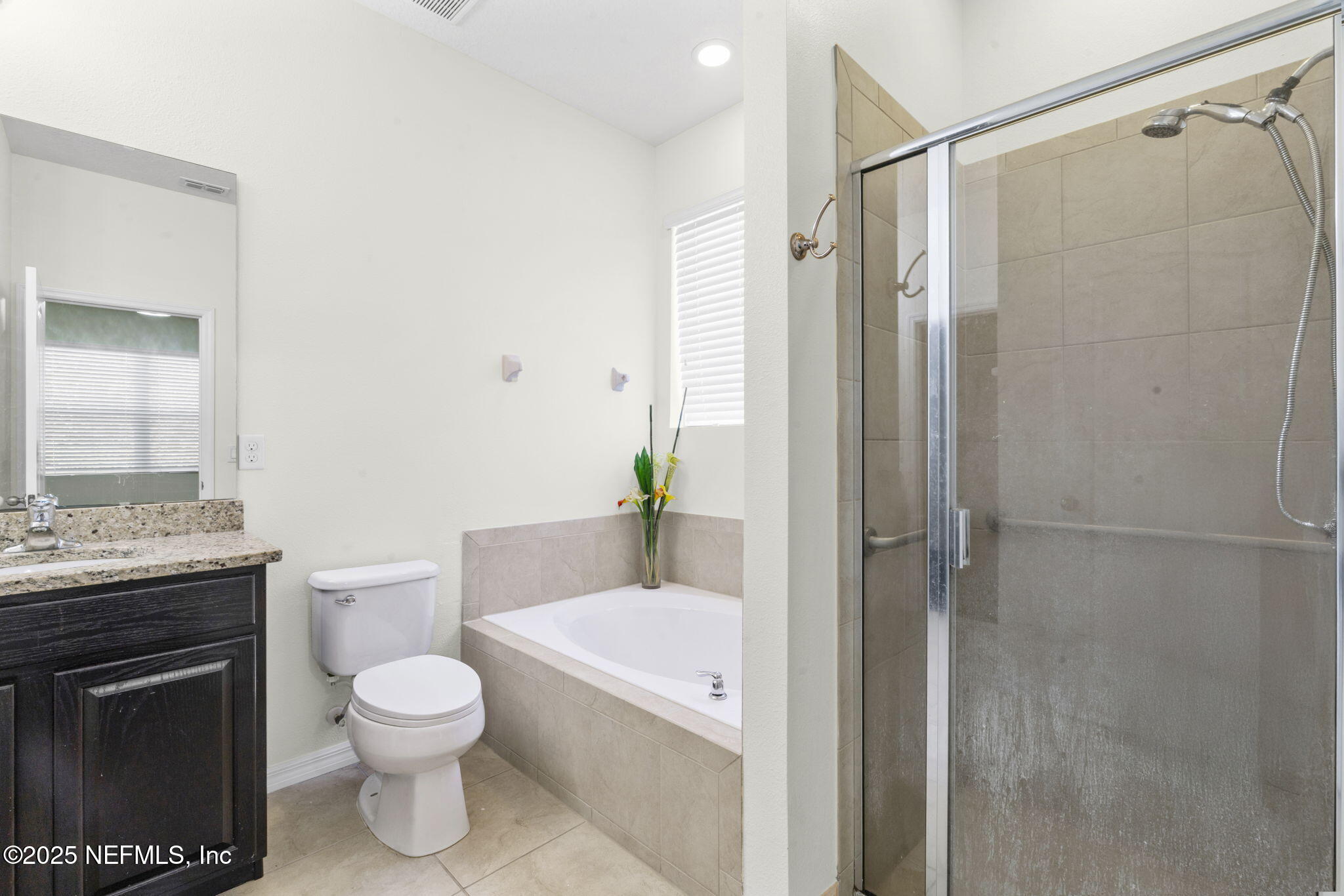 28 Riachuelo Lane St. Augustine, FL 32095 - Photo 36 of 90 a bathroom with a granite countertop toilet sink and shower
