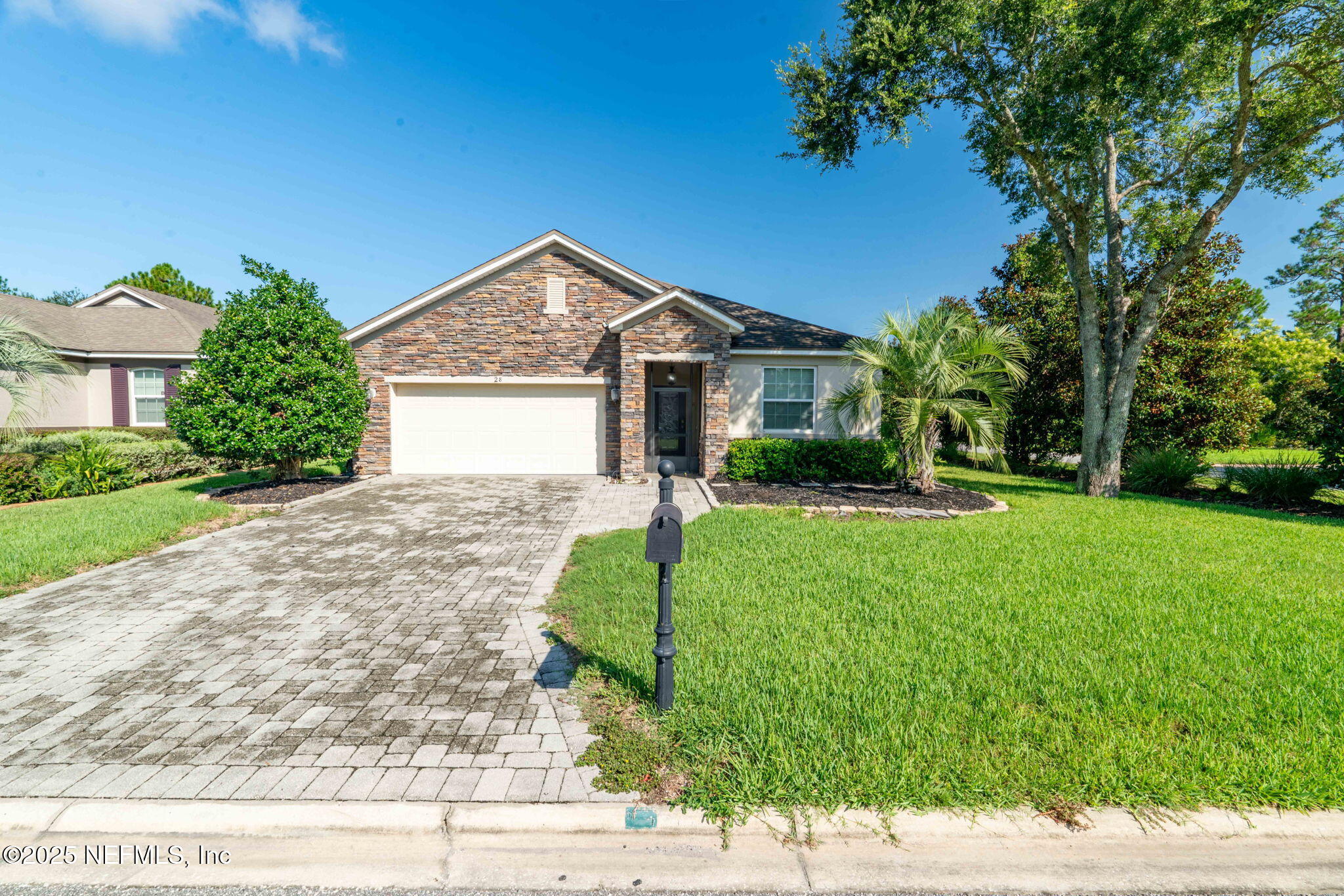 28 Riachuelo Lane St. Augustine, FL 32095 - Photo 56 of 90 a front view of a house with garden