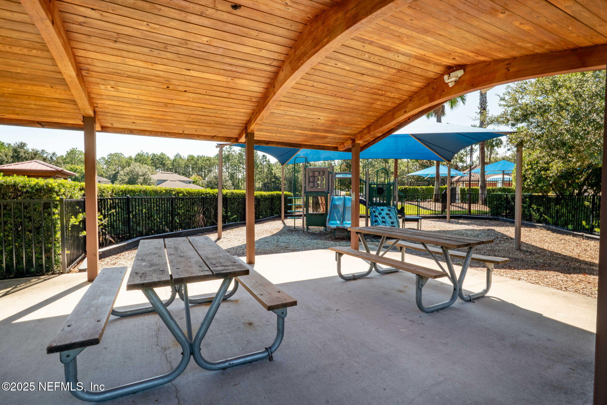 28 Riachuelo Lane St. Augustine, FL 32095 - Photo 86 of 90 a view of a patio with a table and chairs under an umbrella
