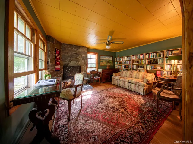 a view of a livingroom with furniture and window