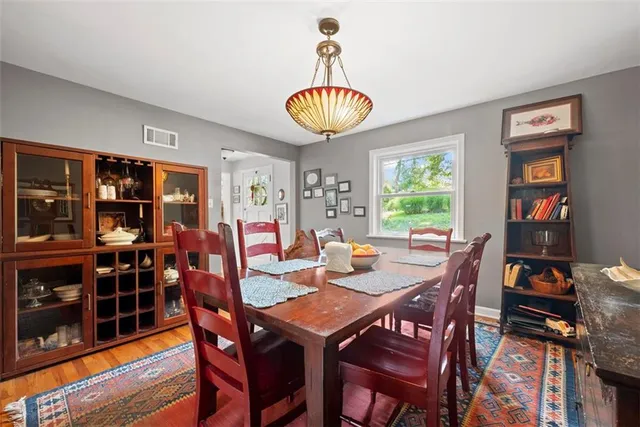 a view of a dining room with furniture and window