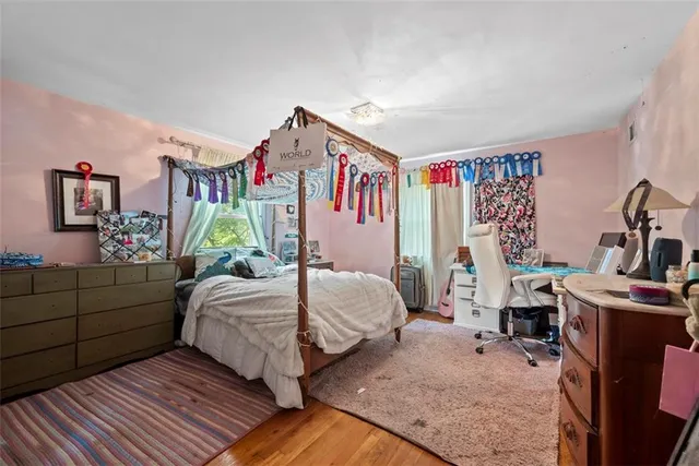 a bedroom with bed and a window