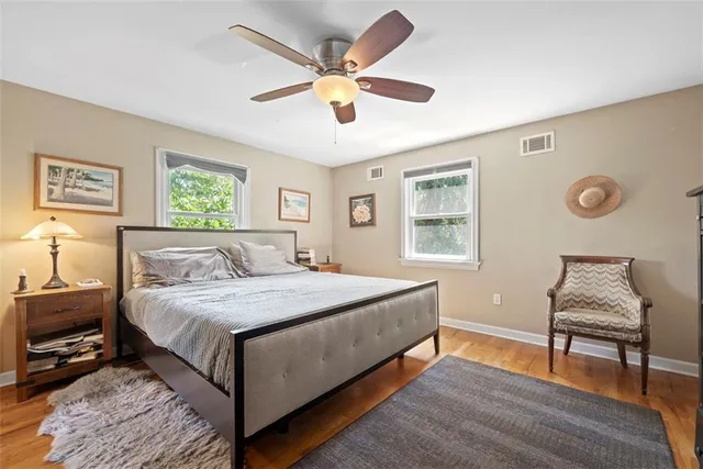 a bedroom with a bed and a couch