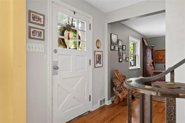 a view of entryway with wooden floor