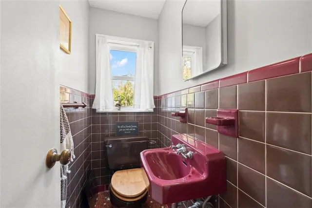 a bathroom with a toilet and a sink