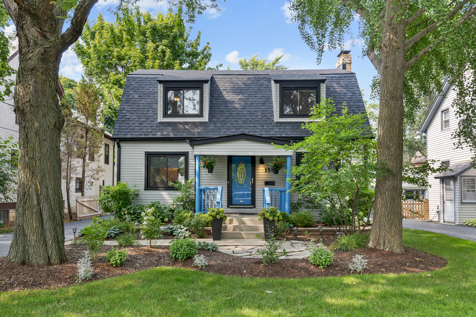 front view of a house with a yard