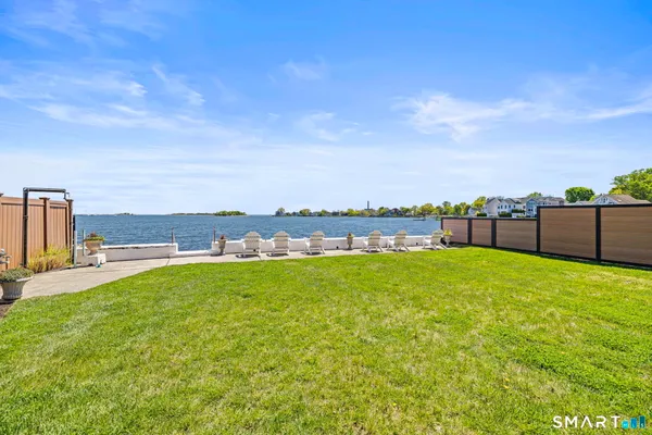 a view of a backyard with ocean view