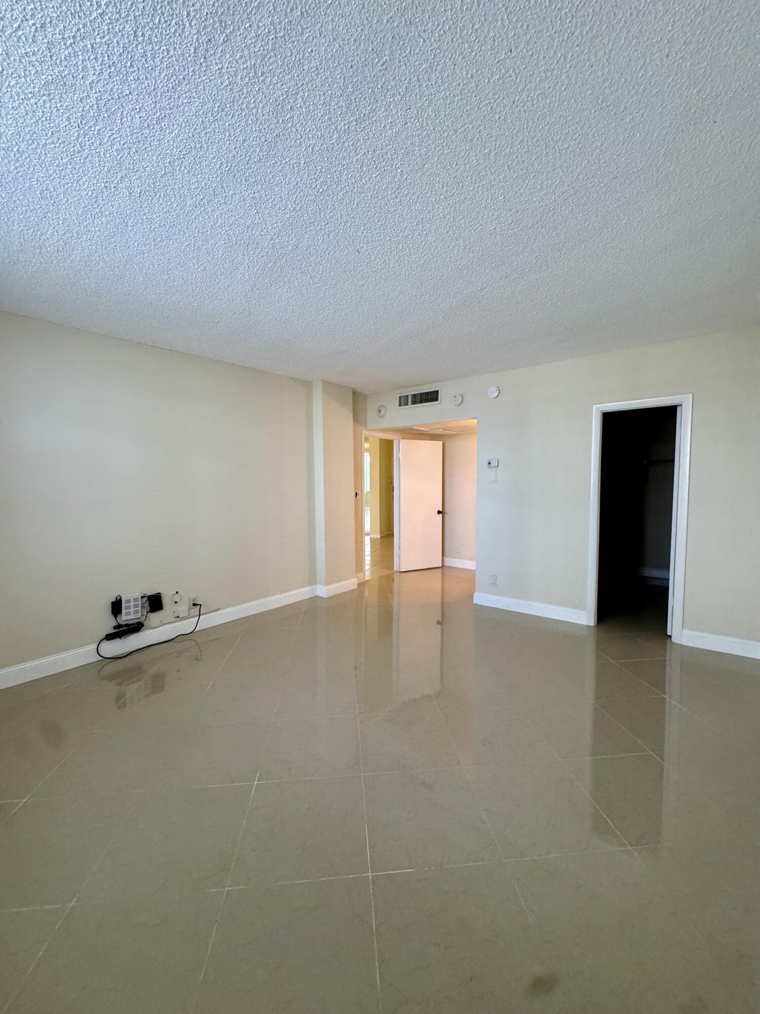 2851 South Ocean Boulevard, Unit 122 Boca Raton, FL 33432 - Photo 11 of 15 a view of an empty room with a window