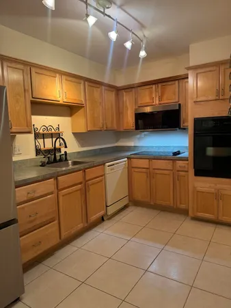 a kitchen with a cabinets and a sink