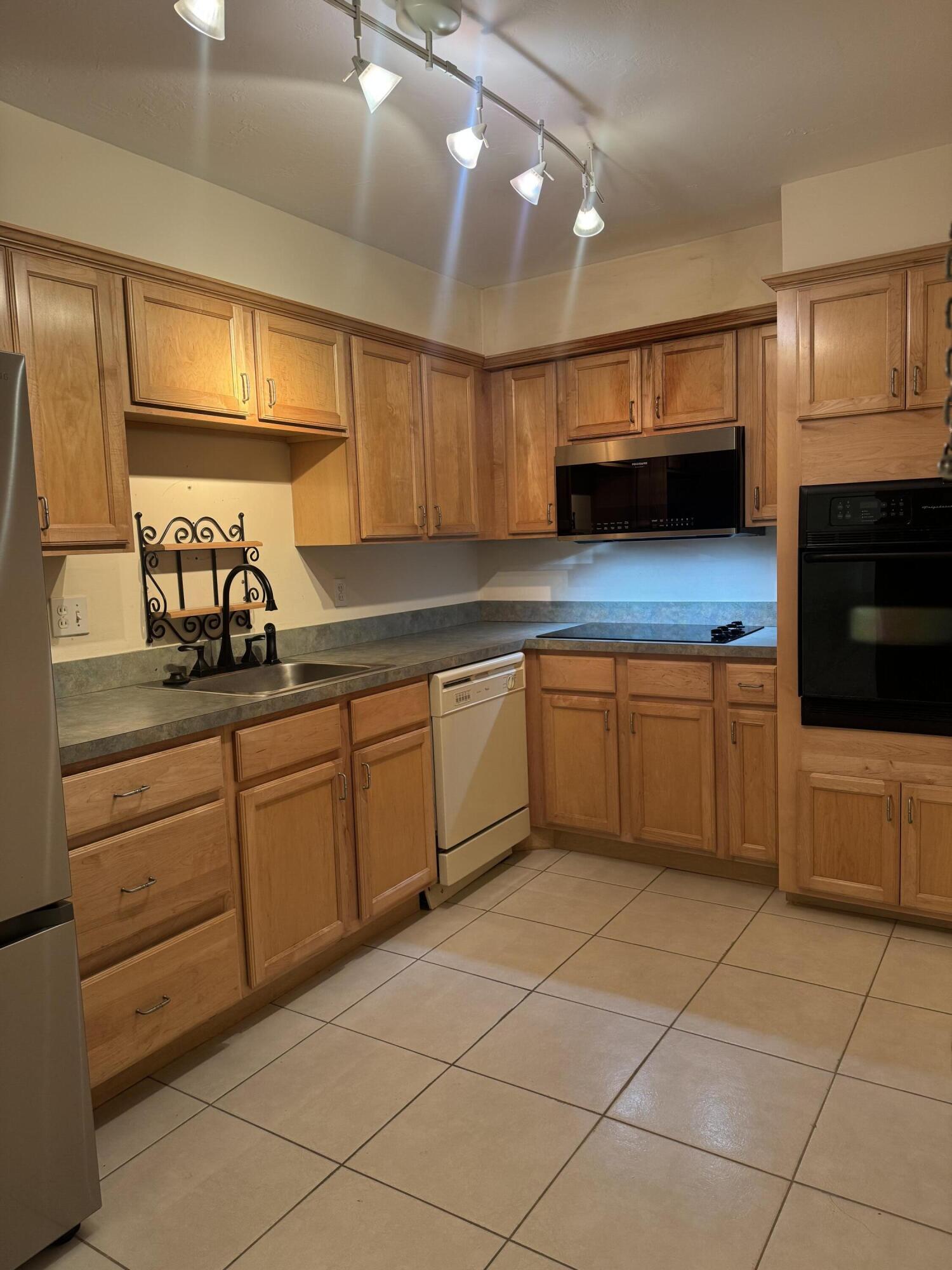 2851 South Ocean Boulevard, Unit 122 Boca Raton, FL 33432 - Photo 4 of 15 a kitchen with a cabinets and a sink
