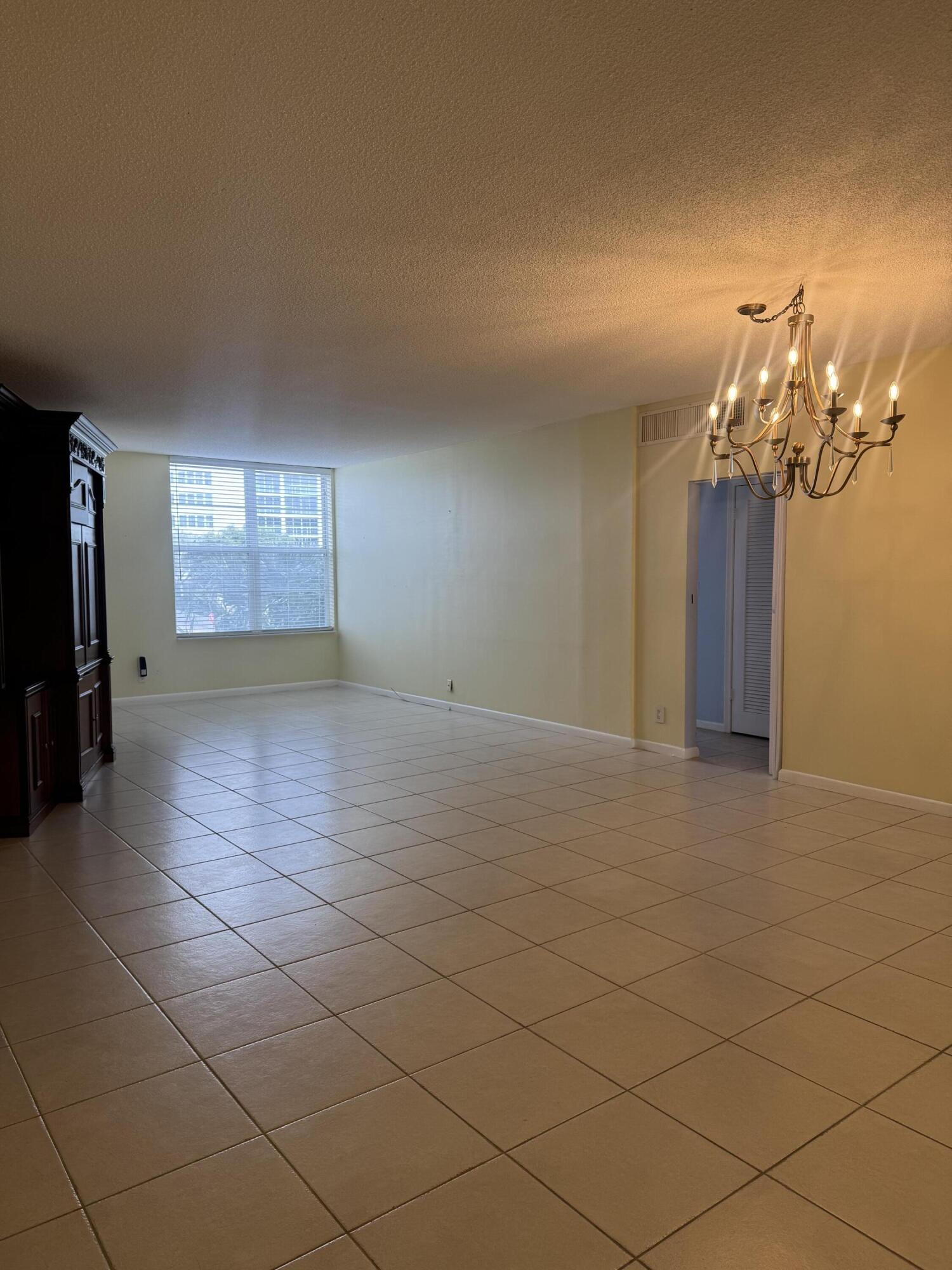 2851 South Ocean Boulevard, Unit 122 Boca Raton, FL 33432 - Photo 6 of 15 a view of a room with a fireplace