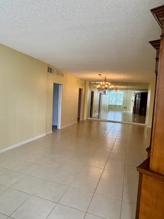 a view of a hallway with an empty room