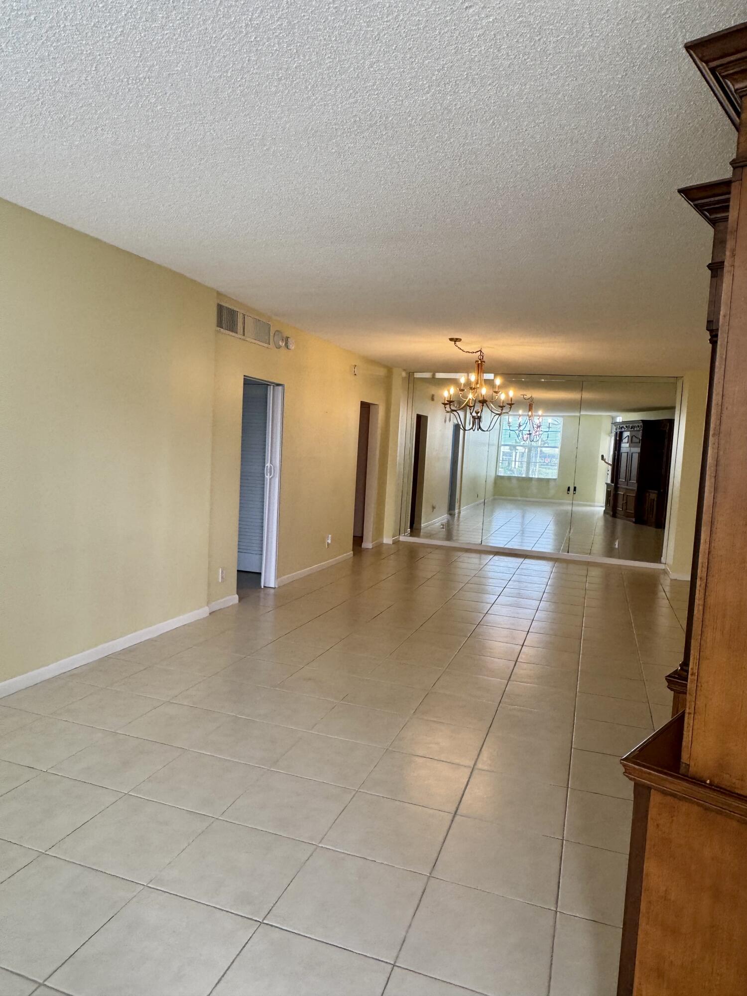 2851 South Ocean Boulevard, Unit 122 Boca Raton, FL 33432 - Photo 7 of 15 a view of a hallway with an empty room
