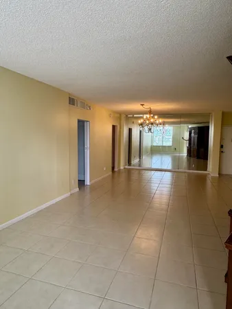 a view of a hallway with an empty room