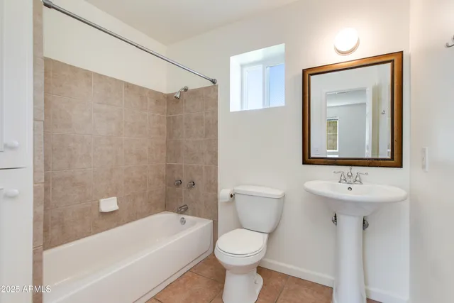 a bathroom with a toilet sink and bathtub