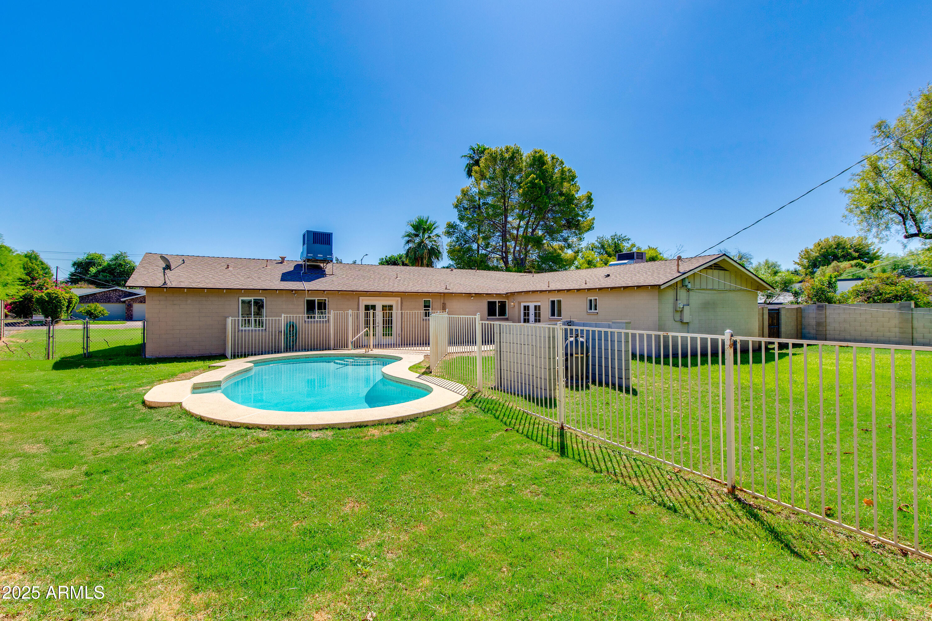 4808 North 29th Place Phoenix, AZ 85016 - Photo 17 of 18 a view of a house with a backyard porch and sitting area