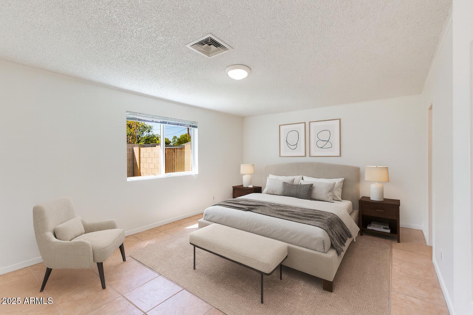 4808 North 29th Place Phoenix, AZ 85016 - Photo 6 of 18 a bedroom with a bed and a couch