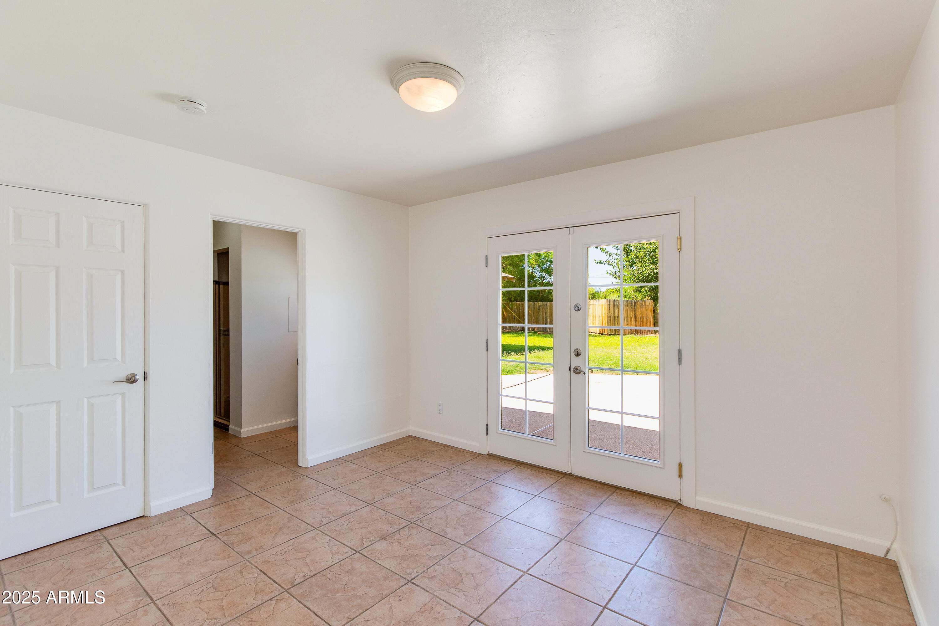 4808 North 29th Place Phoenix, AZ 85016 - Photo 10 of 18 an empty room with windows