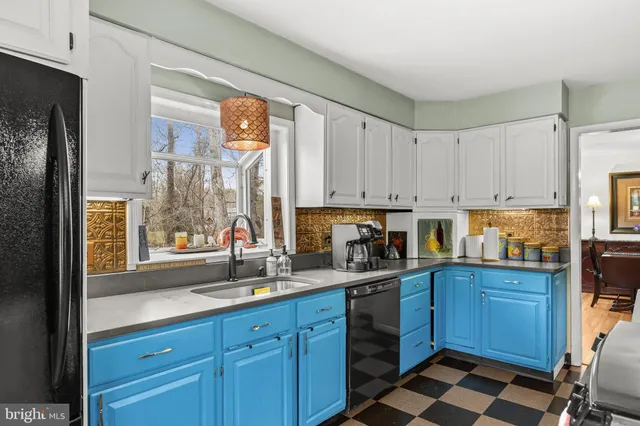 a kitchen with sink cabinets and window