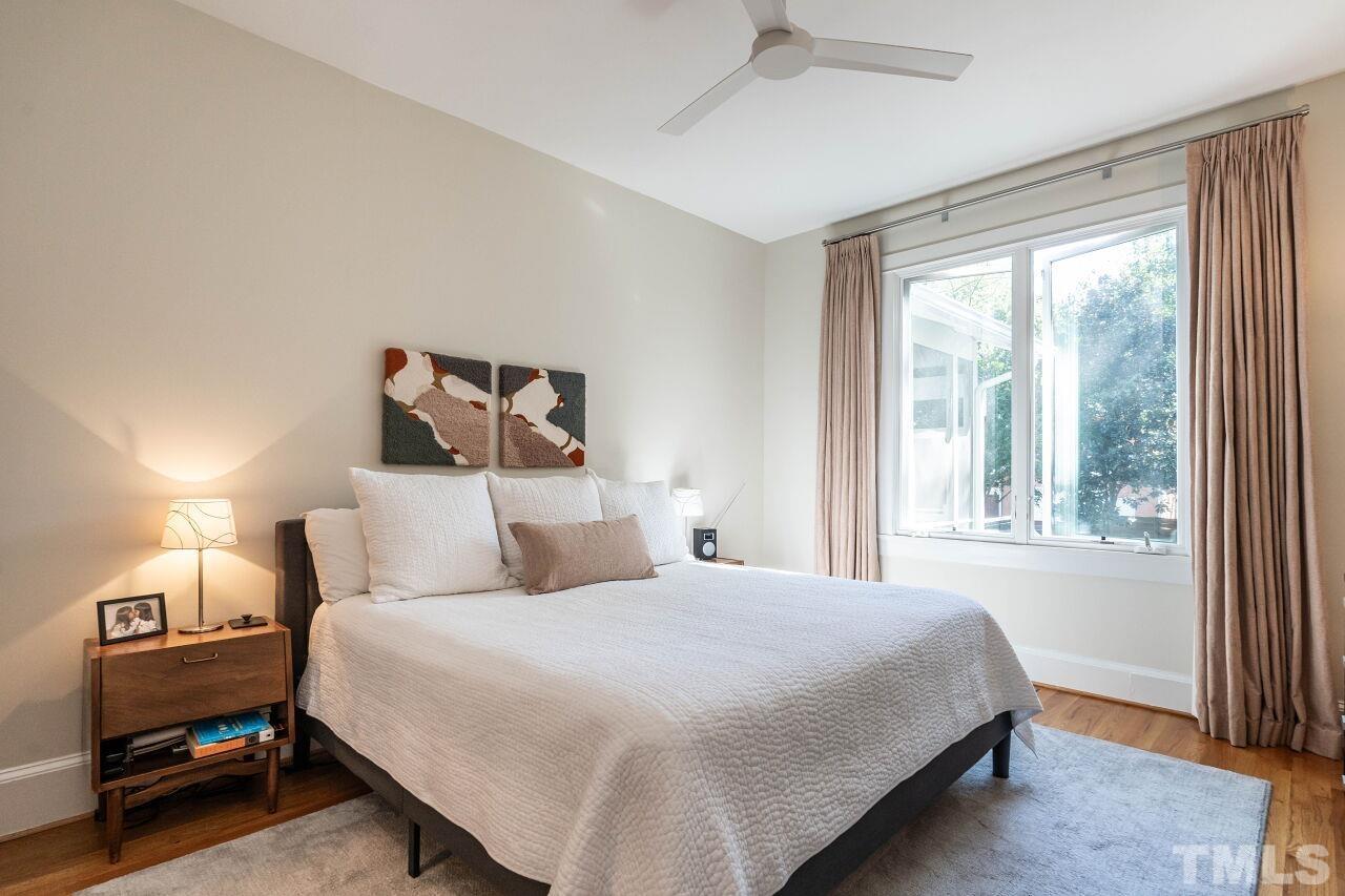 1210 Filmore Street Raleigh, NC 27605 - Photo 18 of 33 a bedroom with a bed and a large window