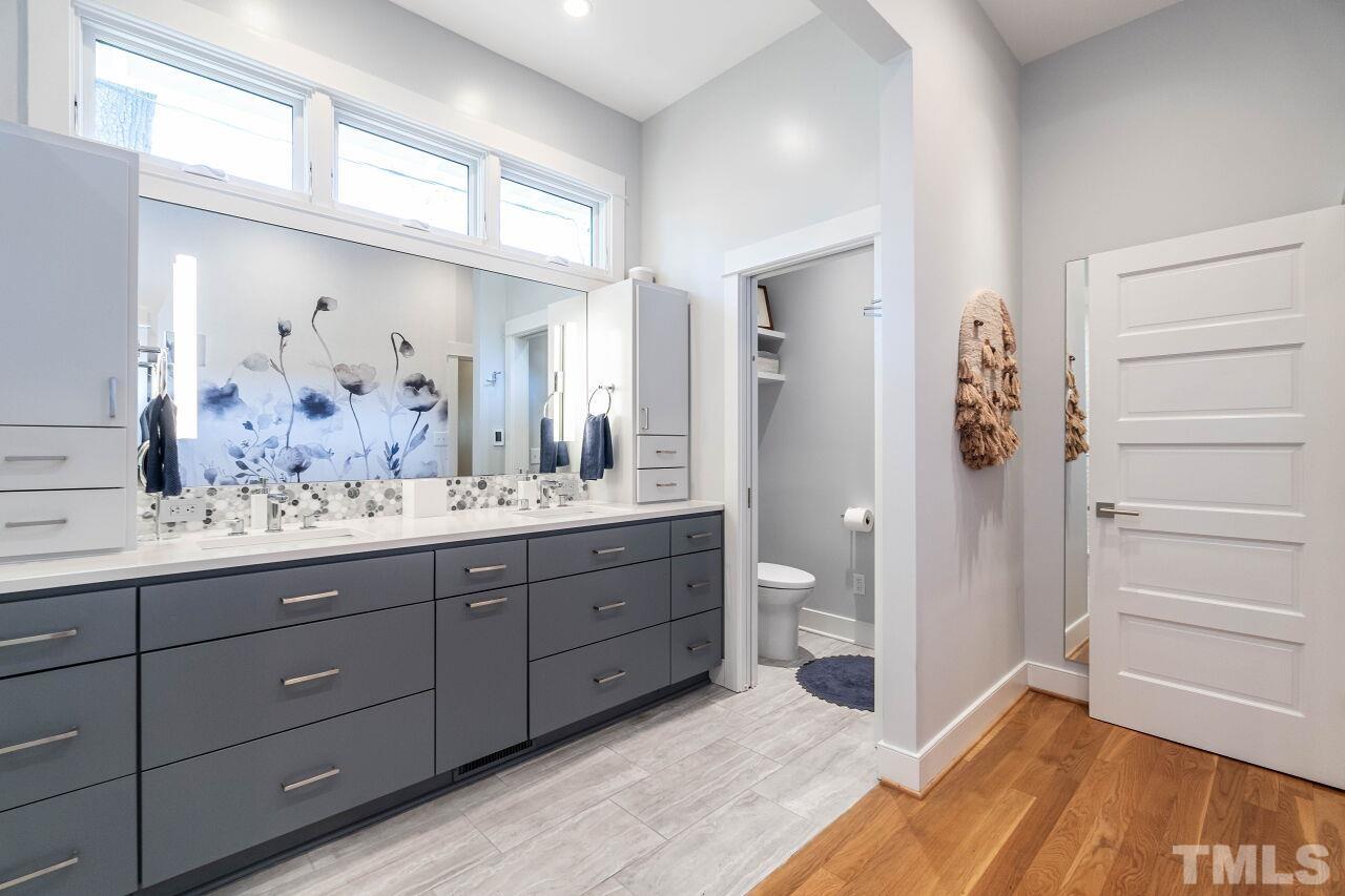 1210 Filmore Street Raleigh, NC 27605 - Photo 21 of 33 a bathroom with a sink and a mirror