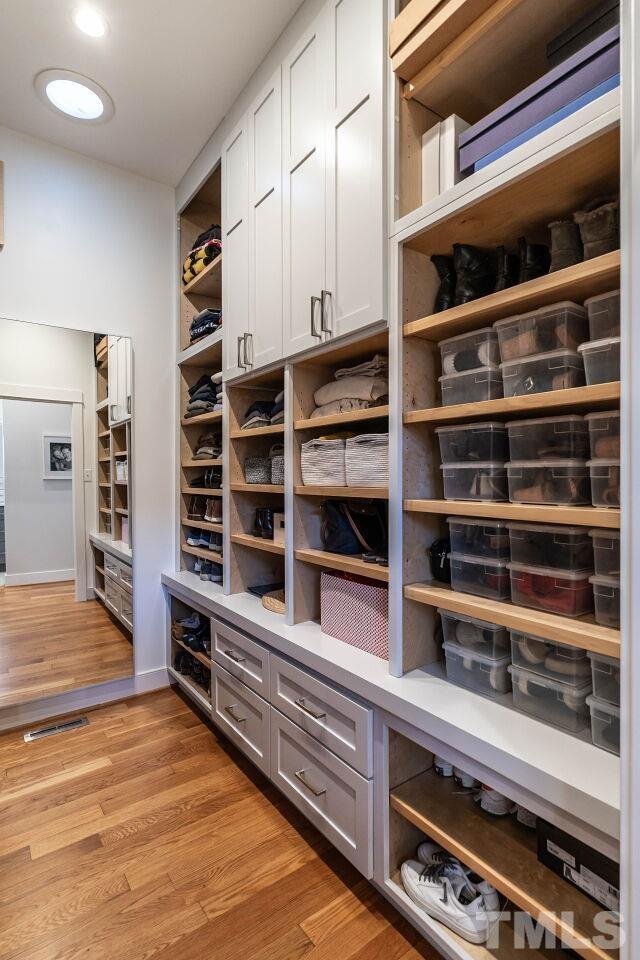1210 Filmore Street Raleigh, NC 27605 - Photo 22 of 33 a view of walk in closet with empty racks