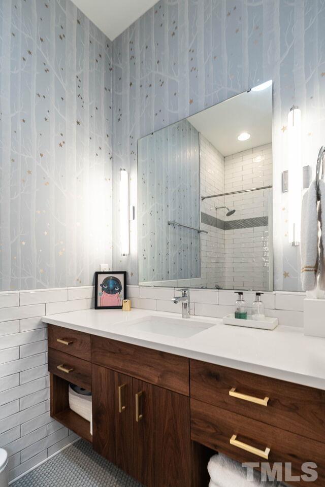 1210 Filmore Street Raleigh, NC 27605 - Photo 24 of 33 a bathroom with a sink and a mirror