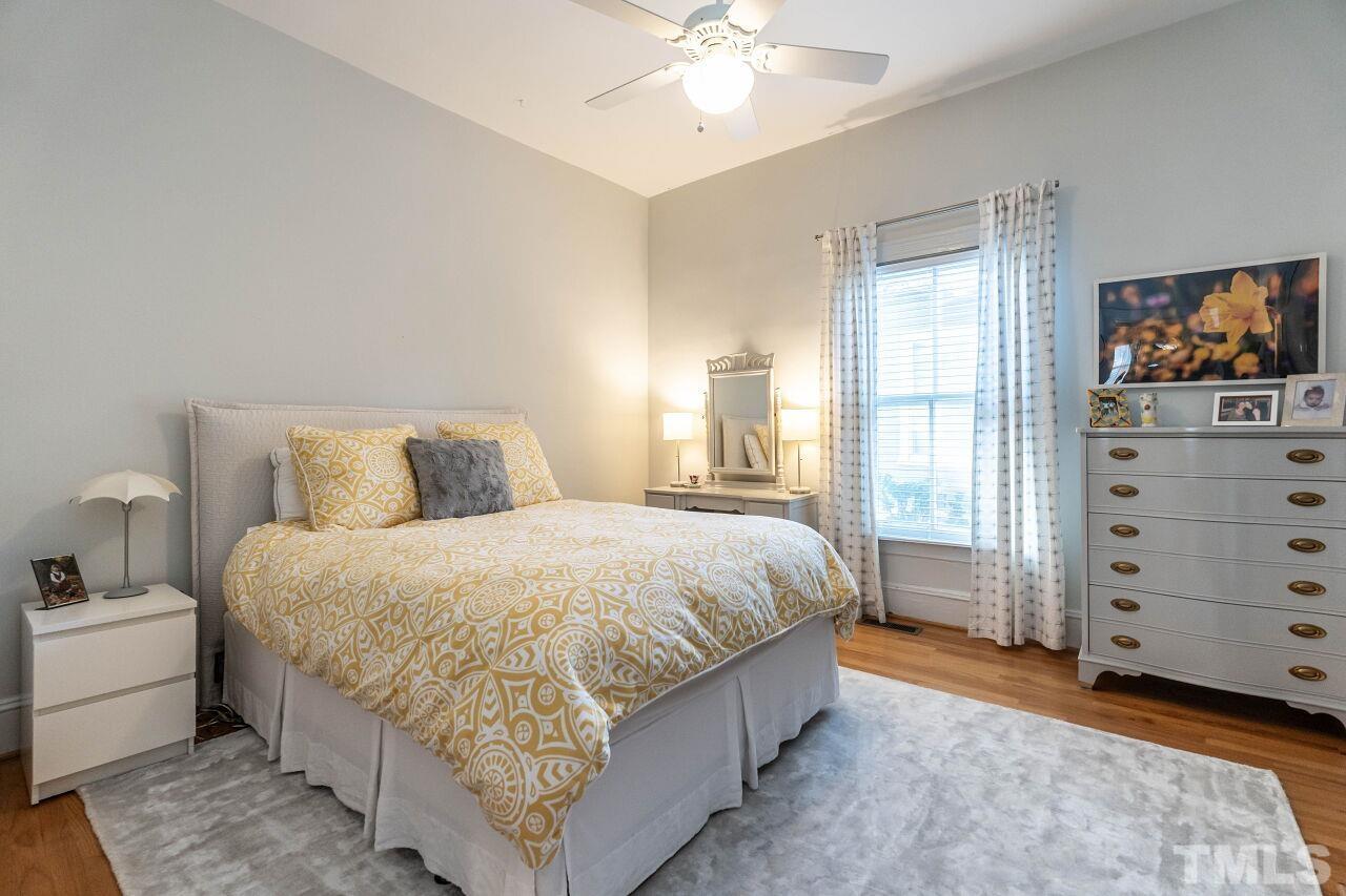 1210 Filmore Street Raleigh, NC 27605 - Photo 26 of 33 a spacious bedroom with a bed and with furniture