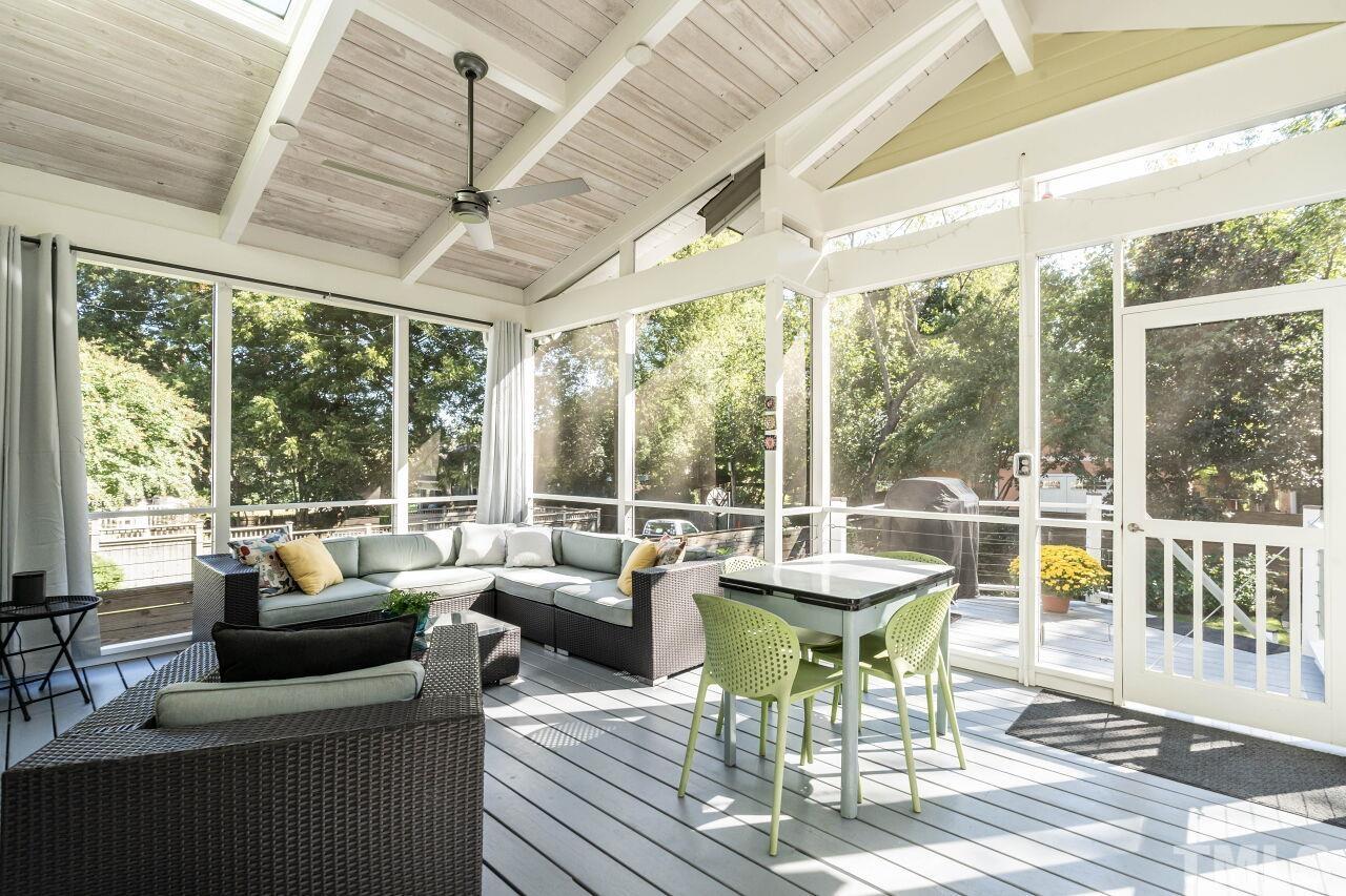 1210 Filmore Street Raleigh, NC 27605 - Photo 28 of 33 a living room with furniture and a floor to ceiling window