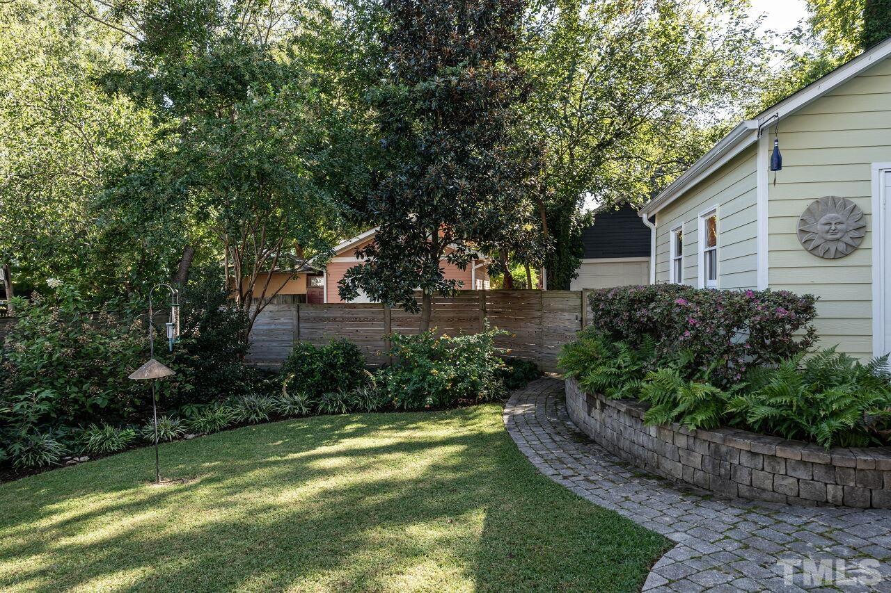 1210 Filmore Street Raleigh, NC 27605 - Photo 30 of 33 a view of a backyard with plants and a garden