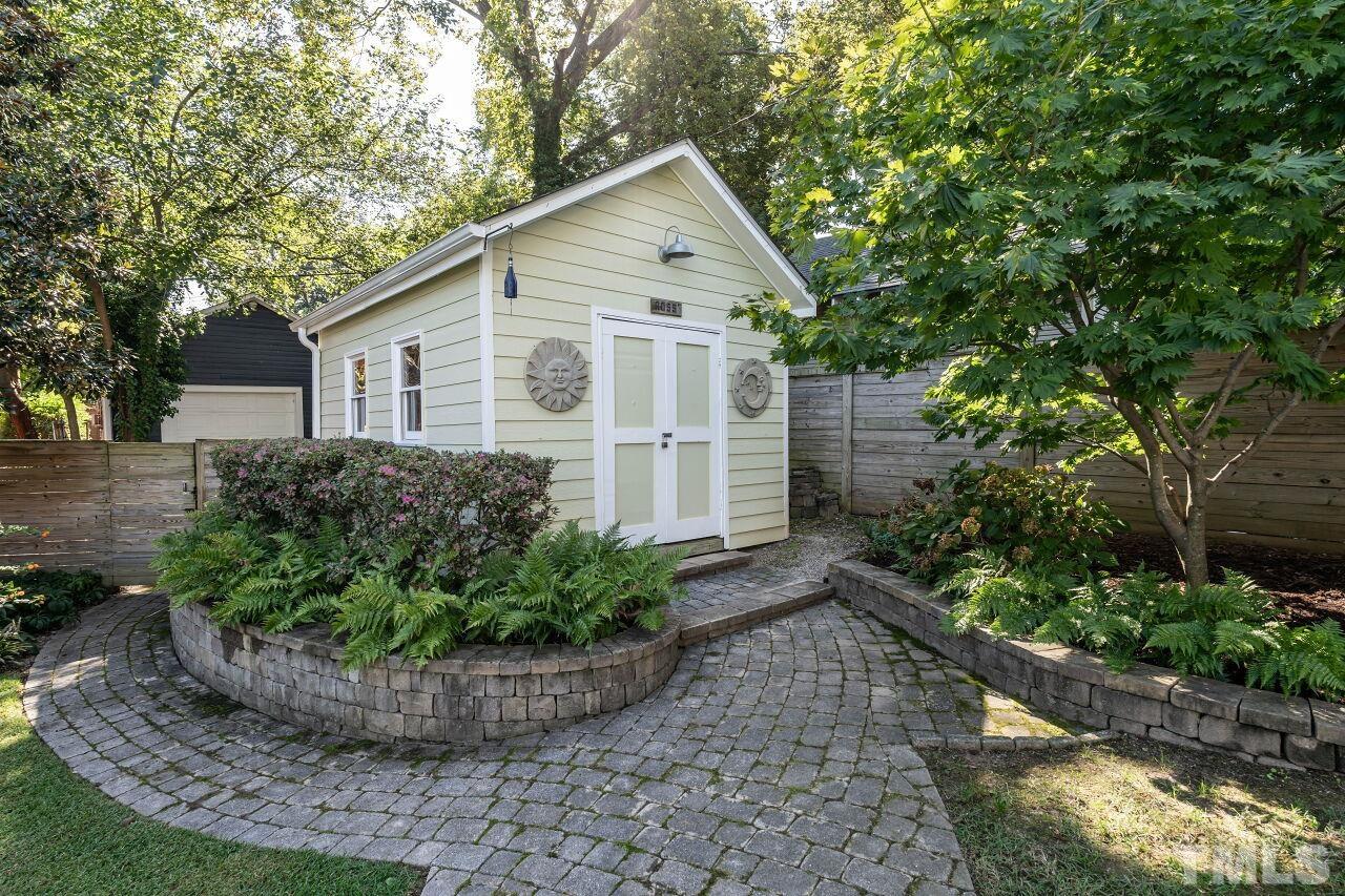 1210 Filmore Street Raleigh, NC 27605 - Photo 31 of 33 a view of a house with a yard and potted plants