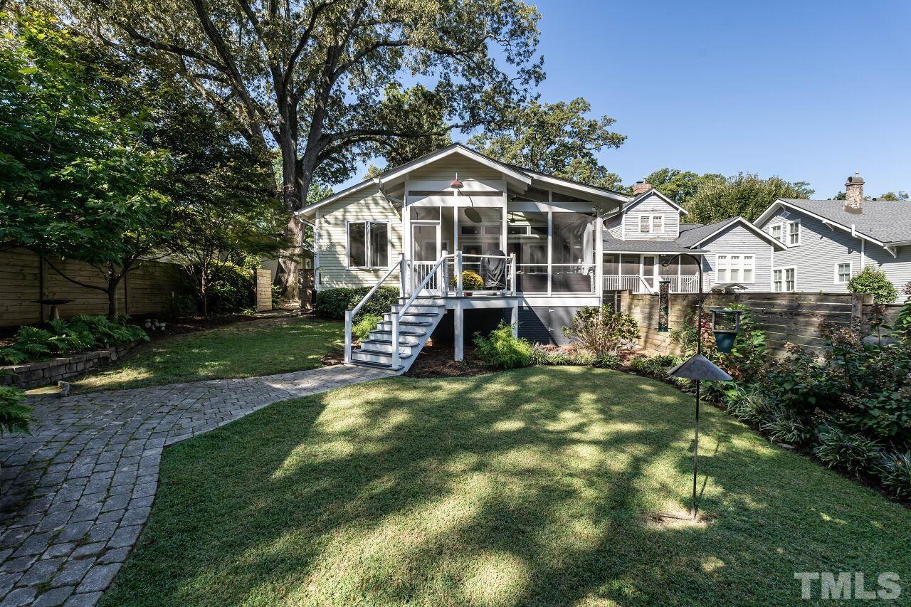 1210 Filmore Street Raleigh, NC 27605 - Photo 32 of 33 a house with green field in front of it