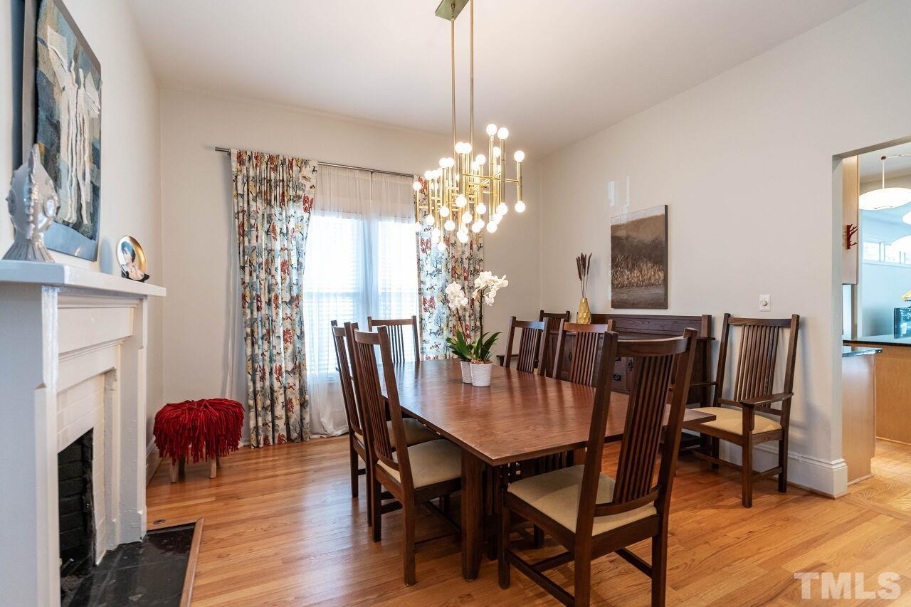 1210 Filmore Street Raleigh, NC 27605 - Photo 7 of 33 a view of a dining room with furniture and wooden floor