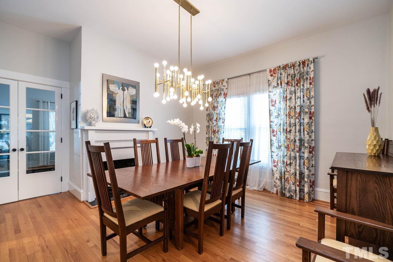 1210 Filmore Street Raleigh, NC 27605 - Photo 8 of 33 a view of a dining room with furniture window and wooden floor
