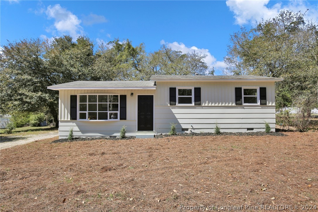 2714 George Owen Road Fayetteville, NC 28306 - Photo 1 of 12 a house with trees in the background