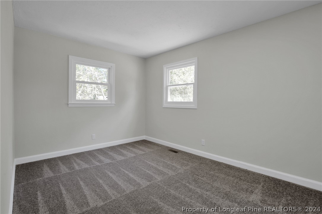 2714 George Owen Road Fayetteville, NC 28306 - Photo 7 of 12 an empty room with a window