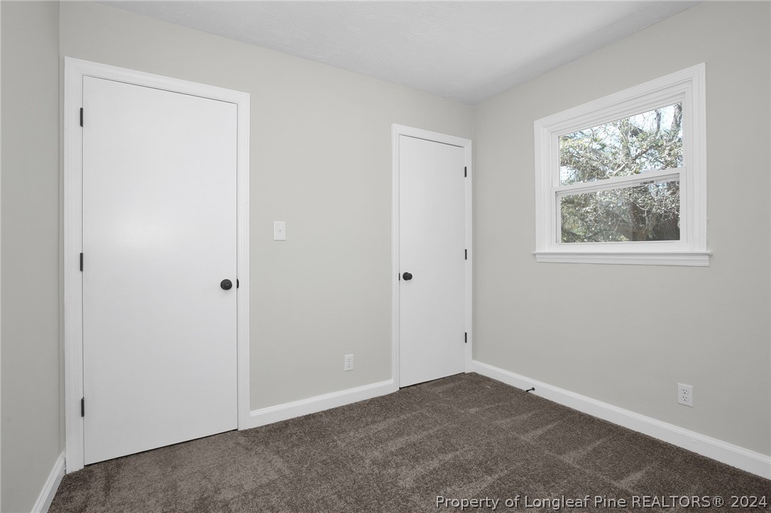 2714 George Owen Road Fayetteville, NC 28306 - Photo 8 of 12 an empty room with windows