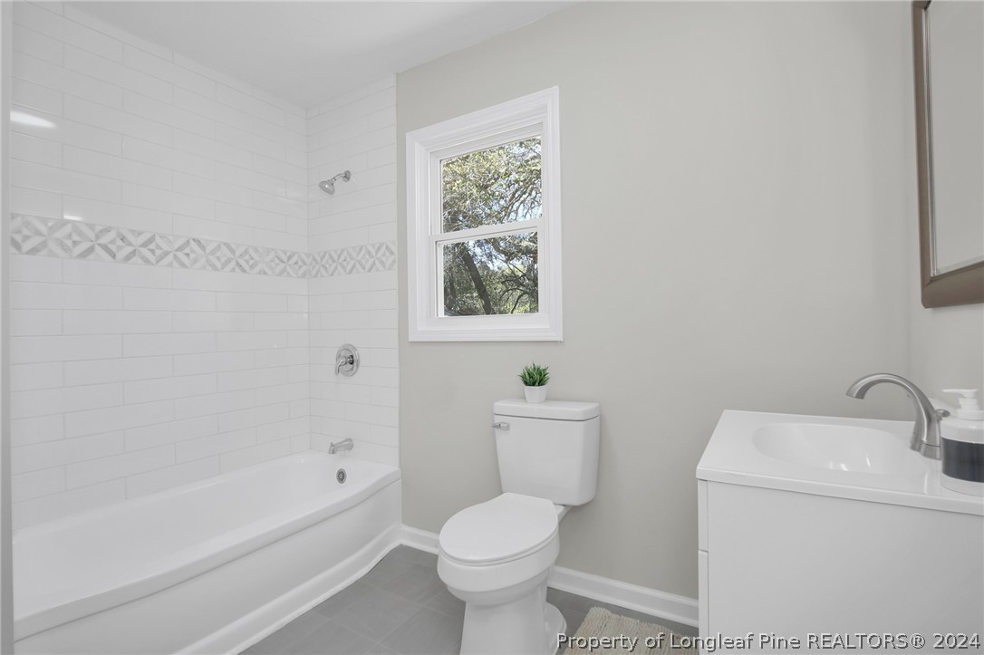 2714 George Owen Road Fayetteville, NC 28306 - Photo 10 of 12 a bathroom with a toilet sink and bathtub