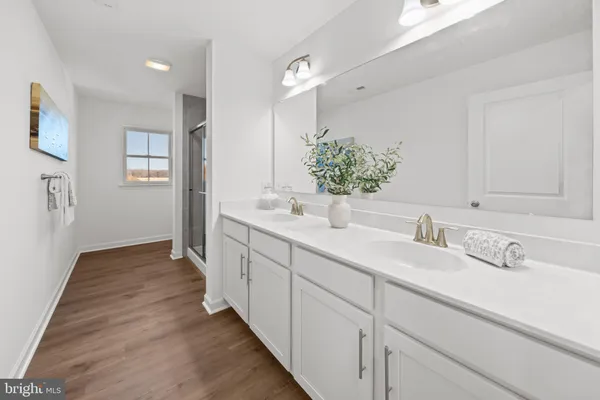 a bathroom with a shower and a tub