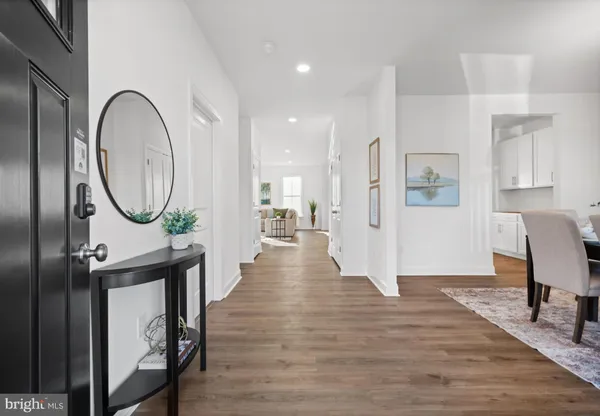 a view of a livingroom with furniture and wooden floor