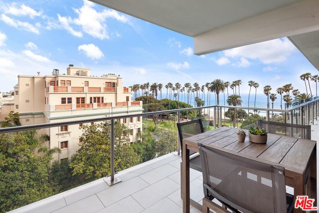 a view of a balcony with city view