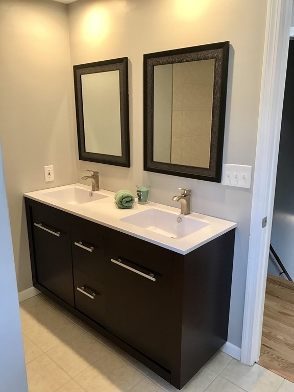 635 Piper Road West Springfield, MA 01089 - Photo 12 of 24 a bathroom with a double vanity sink and a mirror