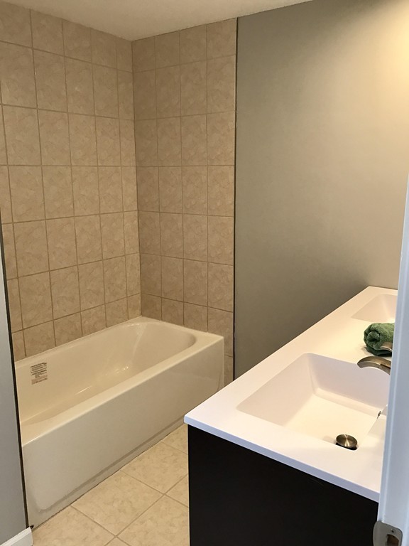 635 Piper Road West Springfield, MA 01089 - Photo 13 of 24 a bathroom with a bathtub and sink